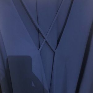 Blue criss cross v neck blouse
